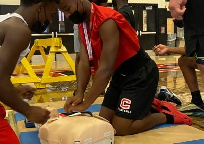 Coatesville student athletes training on CPR + AED