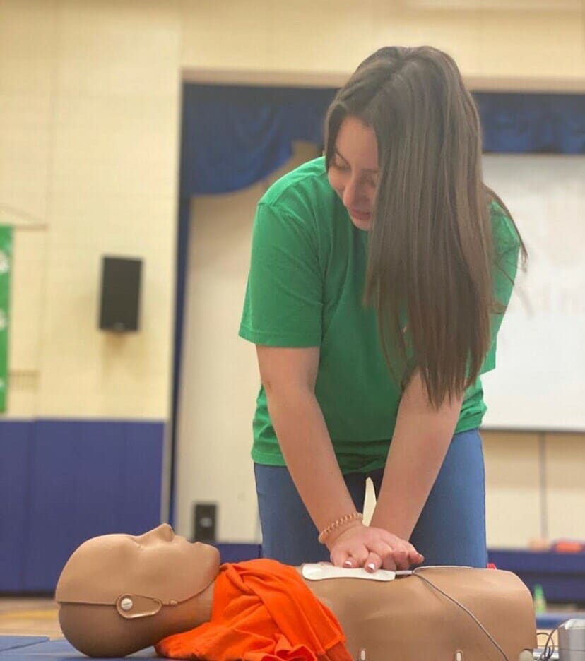 Teigan Brown, training on Hands Only CPR for Aidan's Heart Foundation